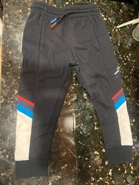 Jordan Kids Black Joggers with Red, Blue and Cream Accents